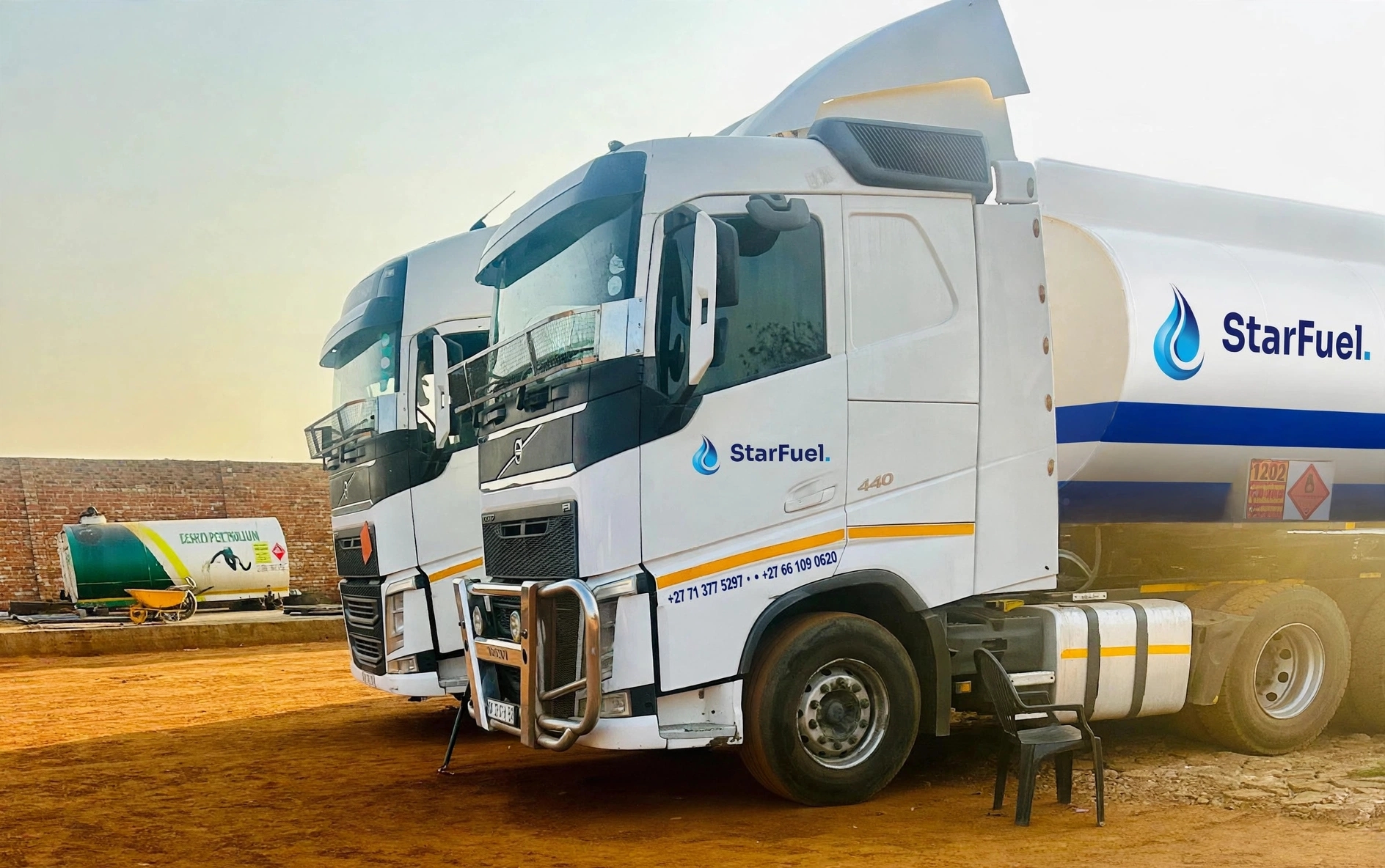 Two StarFuel Volvo tankers parked at dusk